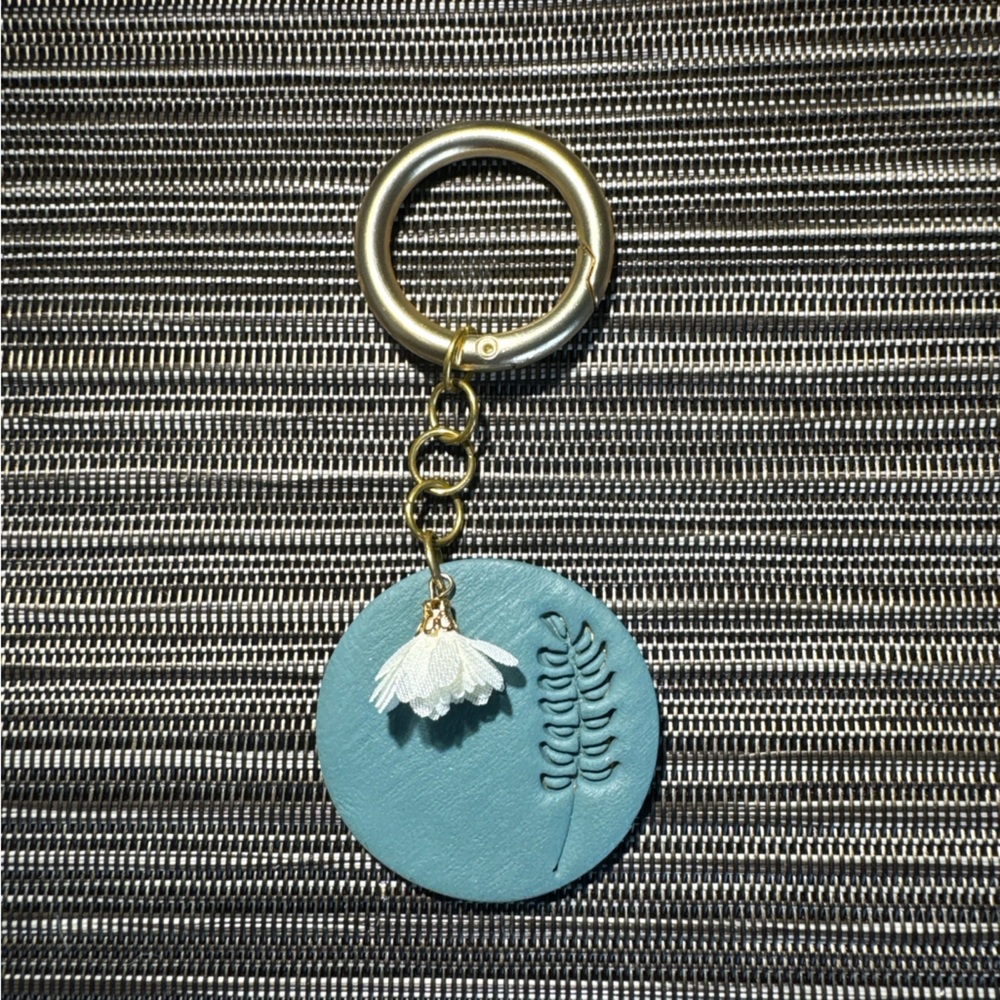Elegant Blue Keychain with Gold Accents